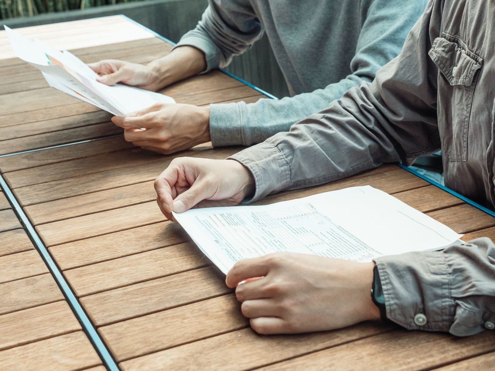 Short Term Disability for Mental Health: How It Actually Works 5 Two people reviewing short term disability benefit forms together at an office table
