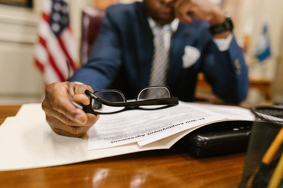Mental Health Parity Law: What MHPAEA Requires, and What It Doesn't 5 Policy documents and reading glasses on a desk
