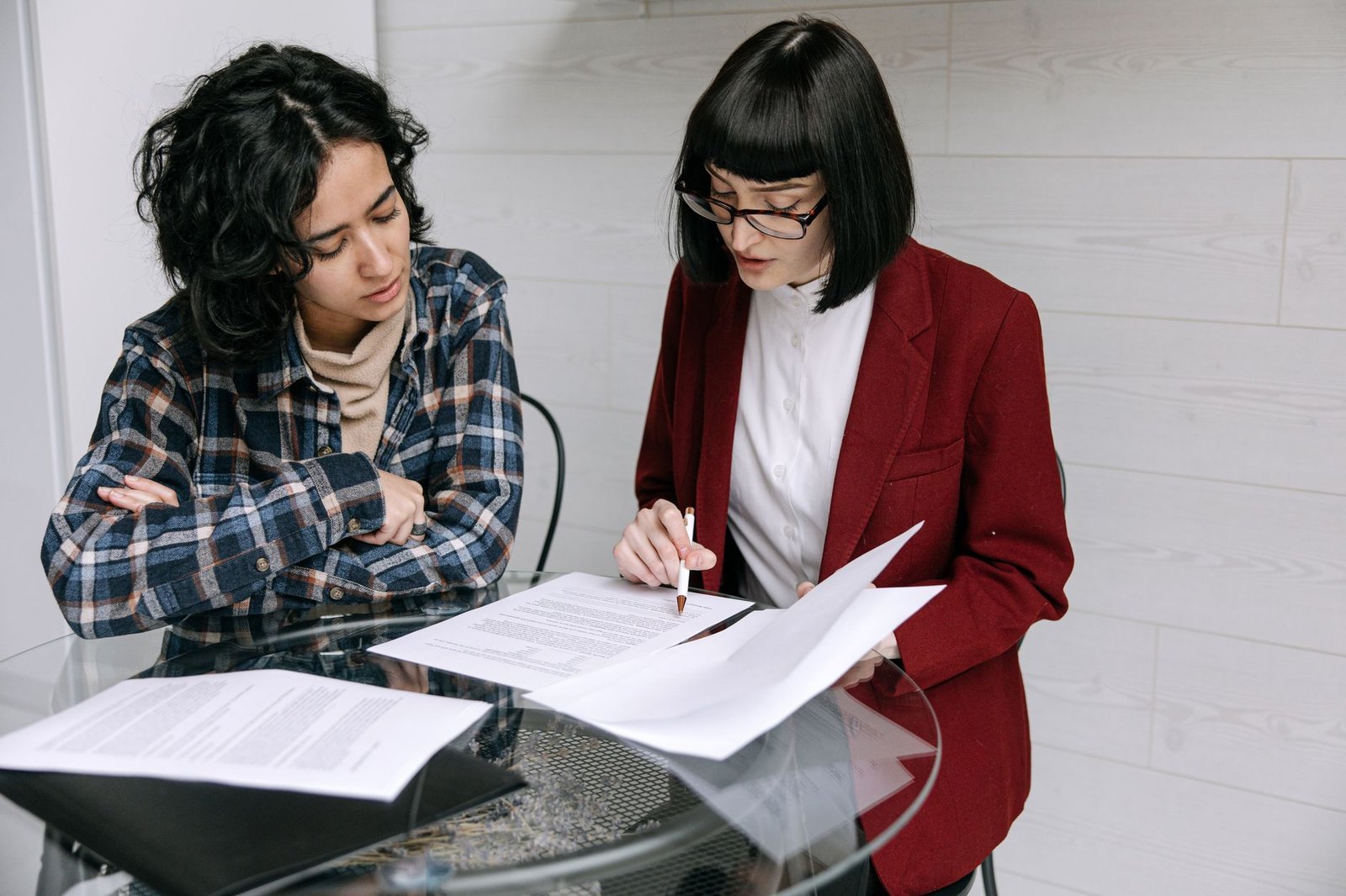 Inpatient Mental Health Treatment Cost: What a Psychiatric Hospital Stay Really Runs 5 Two people comparing a psychiatric hospital bill with an explanation of benefits at a table